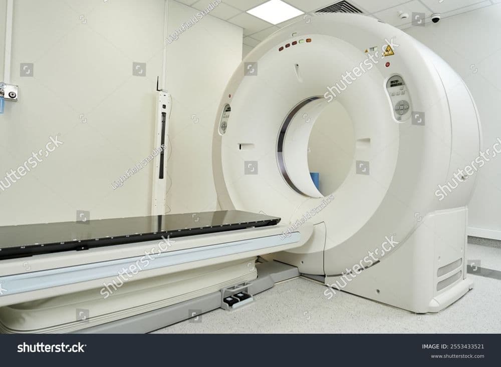 stock-photo-bright-modern-hospital-room-showing-an-mri-machine-ready-for-diagnostic-testing-and-patient-care-2553433521.jpg